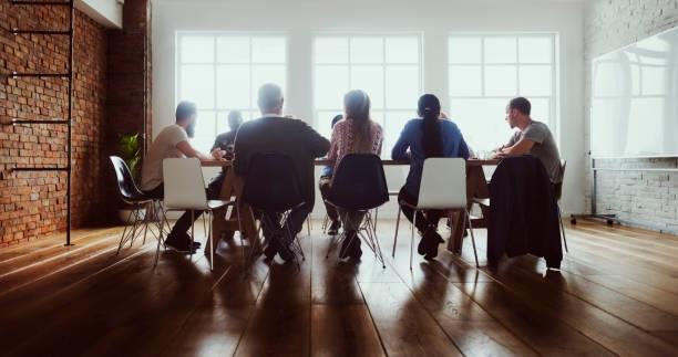 Professionals sat around a table